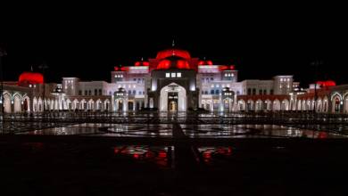 Photo of Qasr Al Watan illuminated in red as the UAE Hope Probe nears Mars